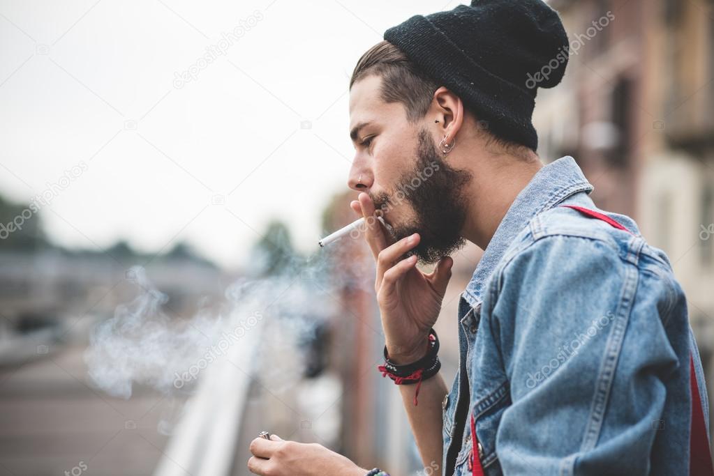 Bearded man smoking cigarette