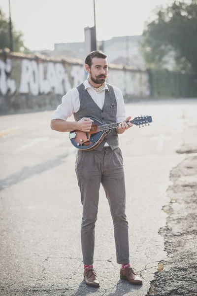 Man with big moustache playing mandolin — Stock Photo, Image