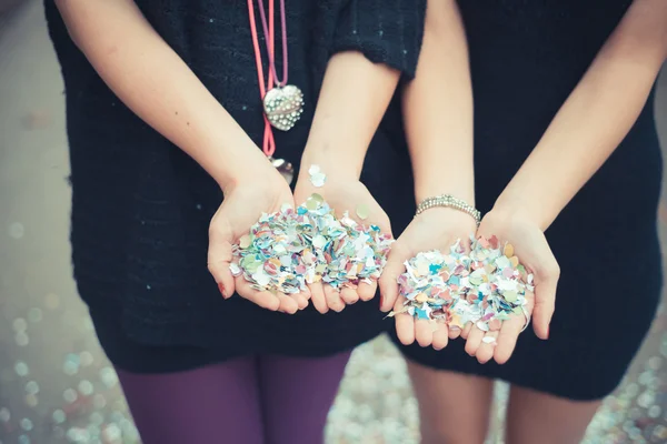 Couple's hands with confetti carnival — Stock Photo, Image