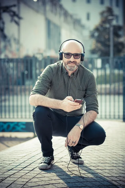 Middle aged man listening to music — Stock Photo, Image