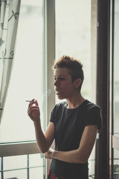 Young lesbian stylish hair style woman smoking — Stock Photo, Image