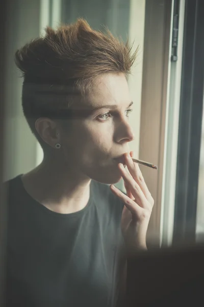 Young lesbian stylish hair style woman smoking — Stock Photo, Image