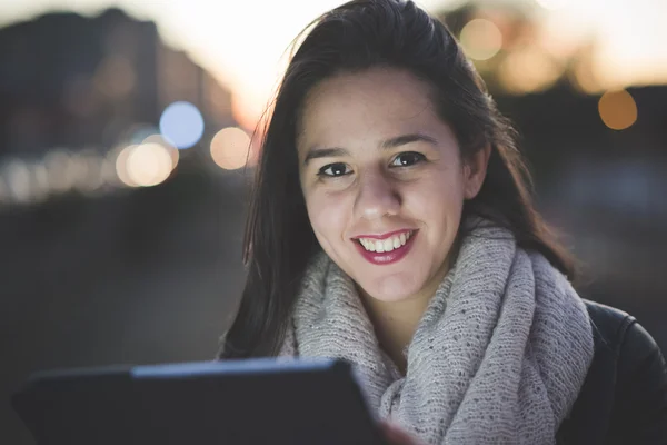 Beautiful young woman with tablet — Stock Photo, Image