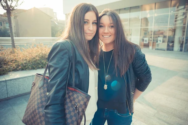 Two young girls in town — Stock Photo, Image