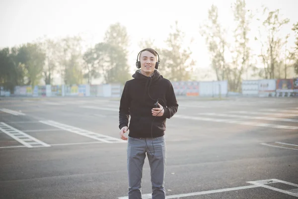 Young asian man listening music — Stock Photo, Image