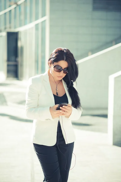 Elegant business woman using smartphone — Stock Photo, Image