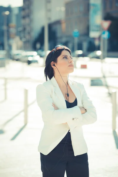 Mujer de negocios con auriculares — Foto de Stock