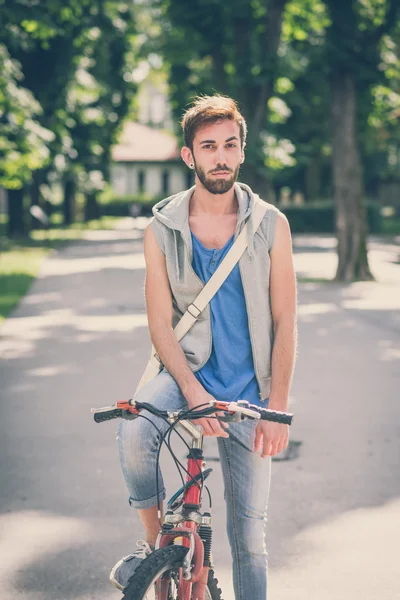 Young hipster gay man with bike — Stock Photo, Image