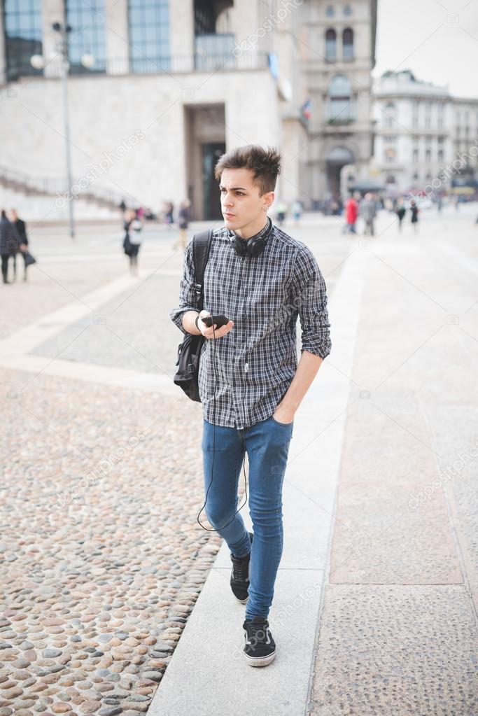 Young handsome man with smartphone and headphones