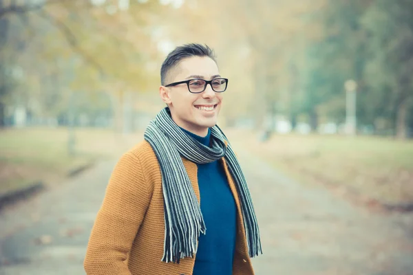 Young handsome caucasian man in autumn park — Stock Photo, Image