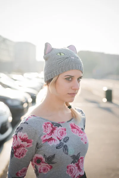 Young beautiful woman in hat