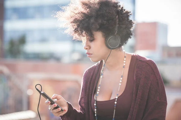 African woman listening music — Stock Photo, Image