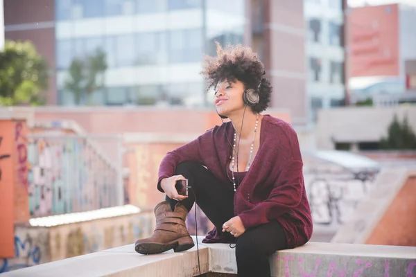 African woman listening music — Stock Photo, Image