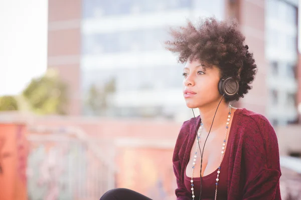 African woman listening music — Stock Photo, Image