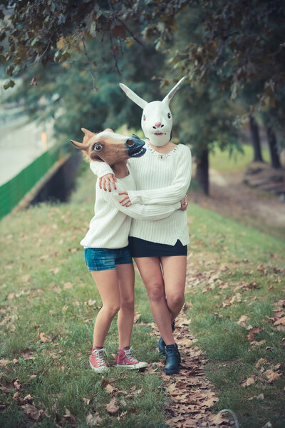 Girls in horse and rabbit mask