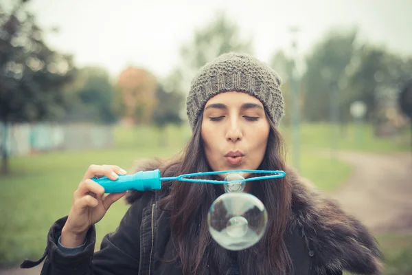 Girl  blowing  soap bubbles — Stock Photo, Image