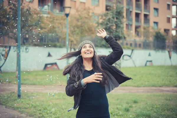 Girl playing with confetti — Stock Photo, Image