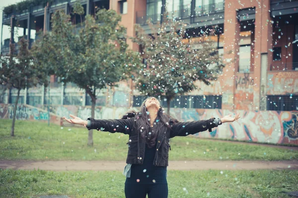 Girl playing with confetti — Stock Photo, Image