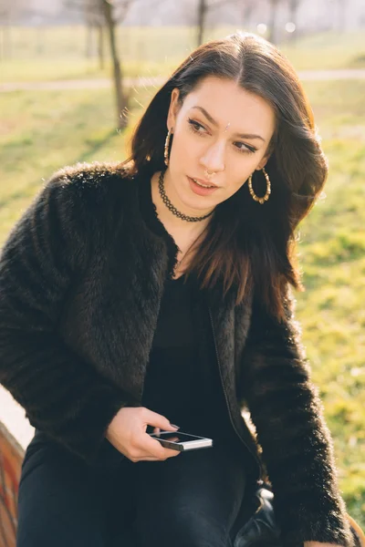 Young beautiful woman using tablet and smartphone — Stock Photo, Image