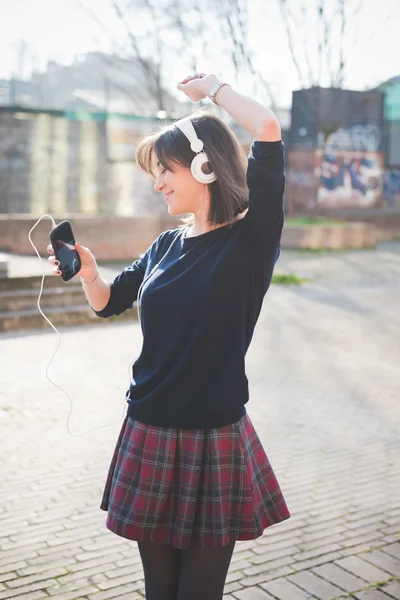 Pretty woman listening music — Stock Photo, Image