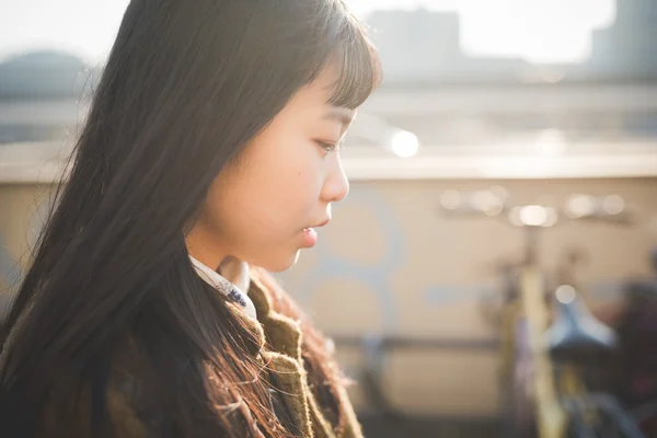 Young asian woman in city — Stock Photo, Image