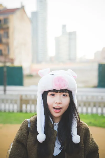 Asian woman in  funny piggy cap — Stock Photo, Image