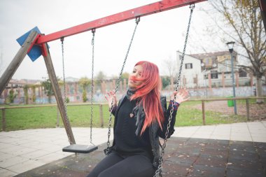 Young beautiful woman on playground