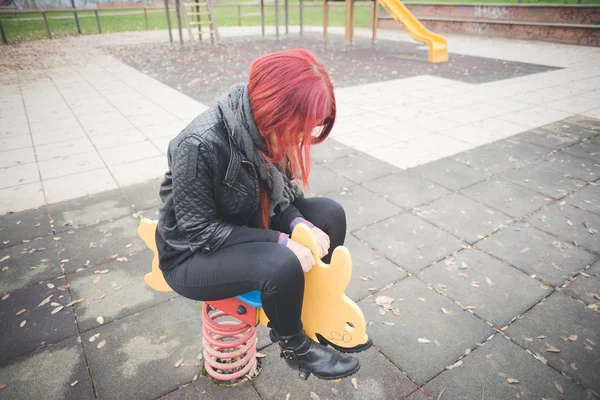 Young beautiful woman on playground — Stock Photo, Image