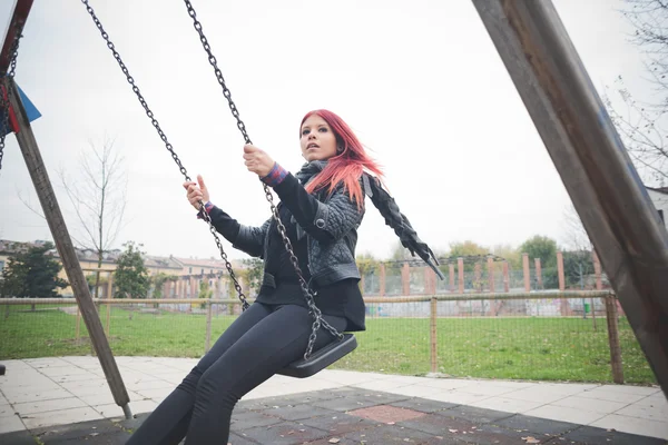Young beautiful woman on playground — Stok fotoğraf
