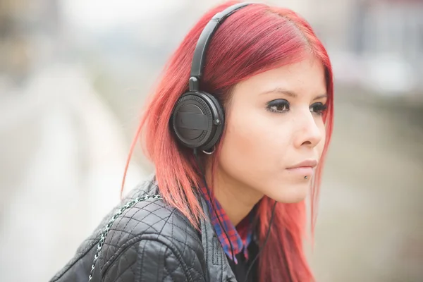 Venezuelan woman listening music — Stok fotoğraf