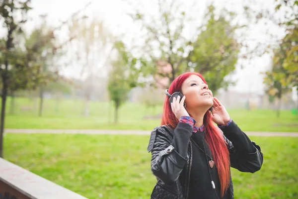 Venezuelan woman listening music — Stok fotoğraf