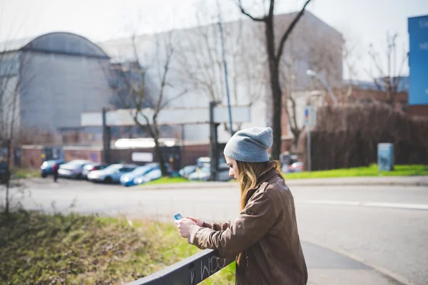 Hipster woman with mobile phone — Stockfoto