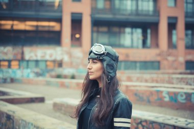 beautiful brunette woman with cap and glasses