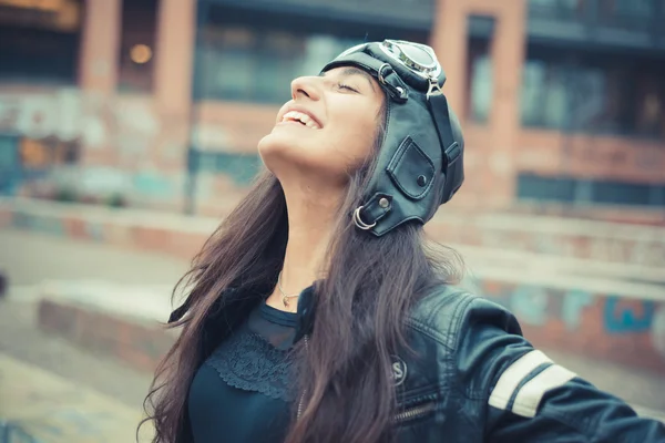 Beautiful brunette woman with cap and glasses — Stock Photo, Image