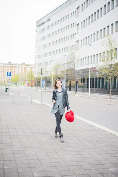 Beautiful brunette girl walking in city — Stock Photo, Image