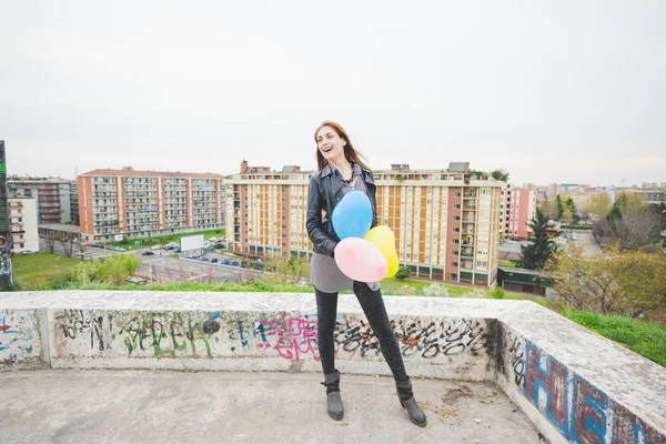 Girl playing with colorful baloons — Stock Photo, Image