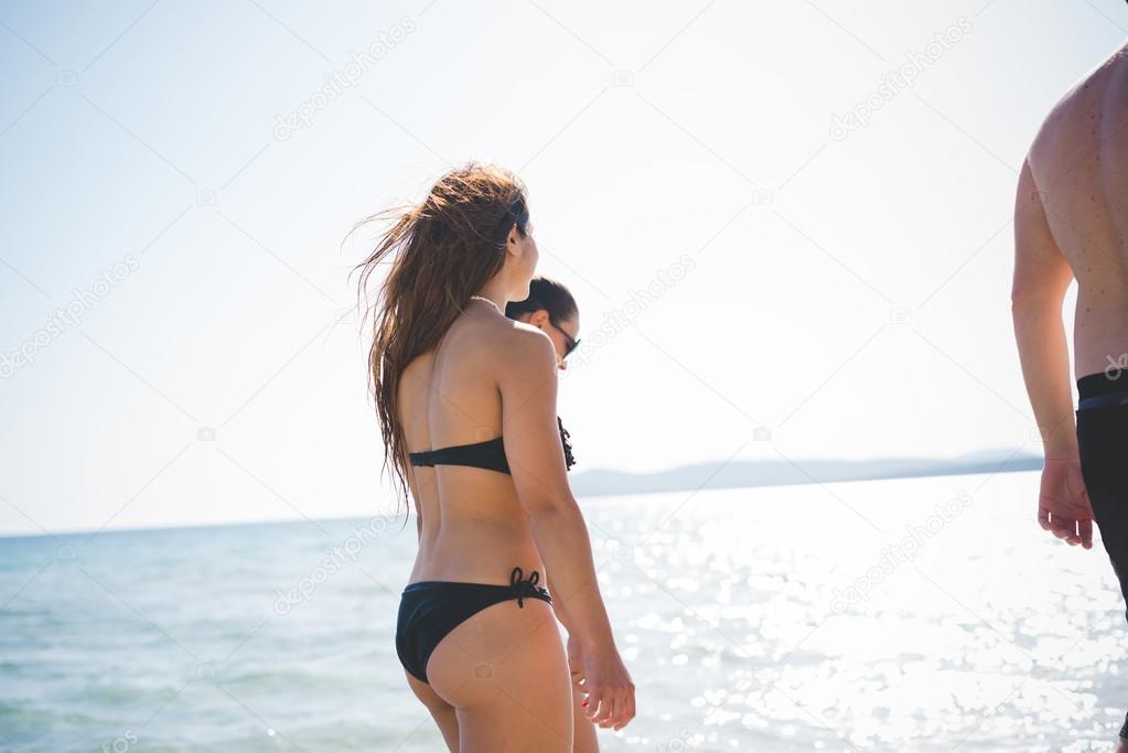 friends on beach in summer