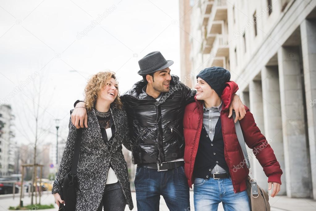 three friends walking in city
