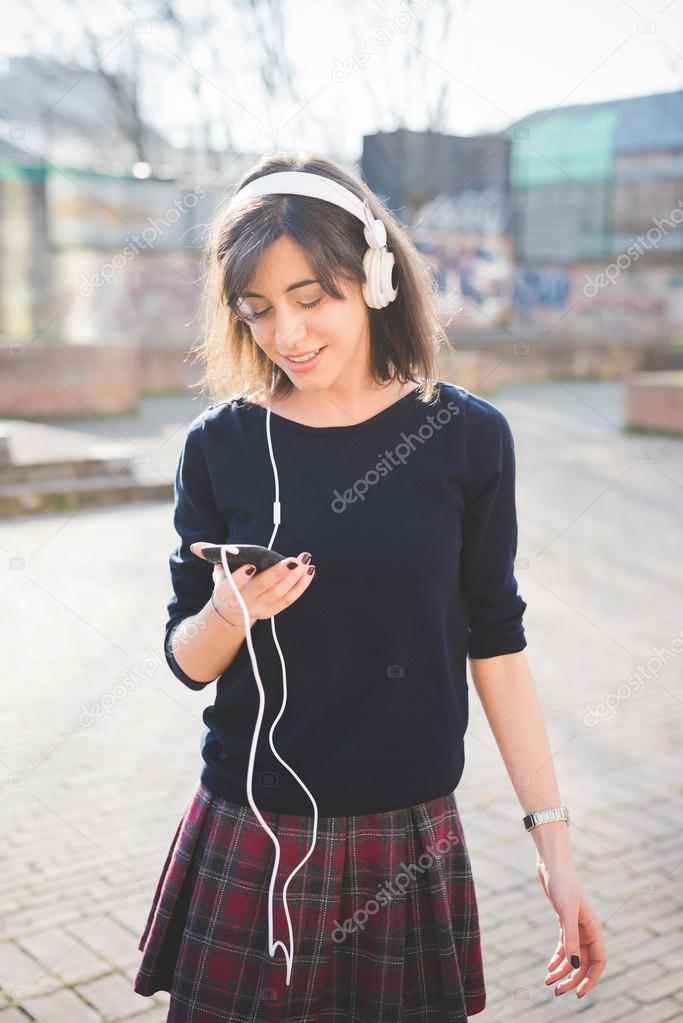 young pretty woman listening music