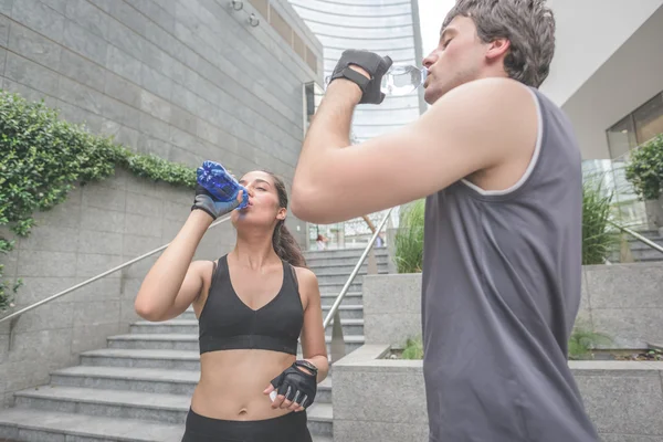 Young handsome sportive man and woman — Stock Photo, Image