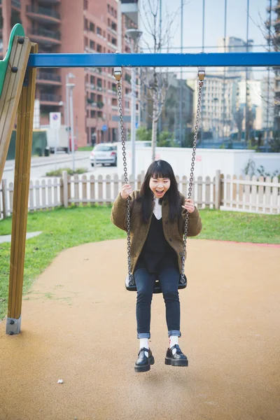 Beautiful asian hipster woman in city — Stock Photo, Image