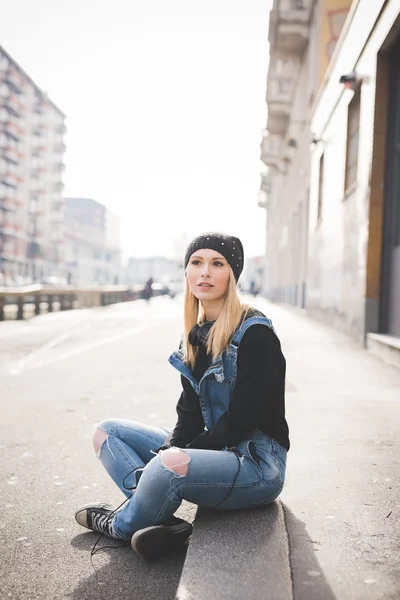 stock image Young beautiful blonde woman in city