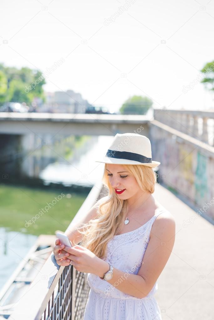 young blonde woman in the city