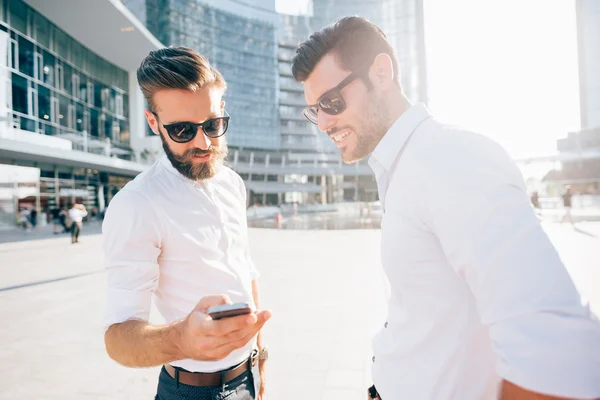 Businessmen using smartphone — Stock Photo, Image