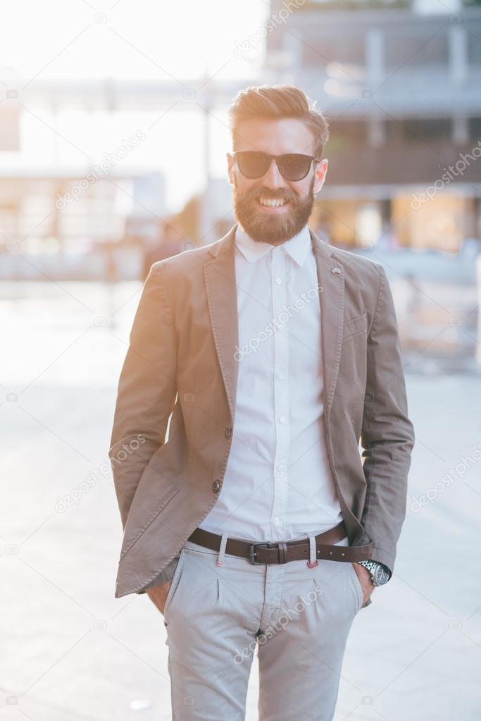 Young modern businessman posing