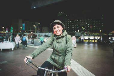 Caucasian woman riding a bicycle