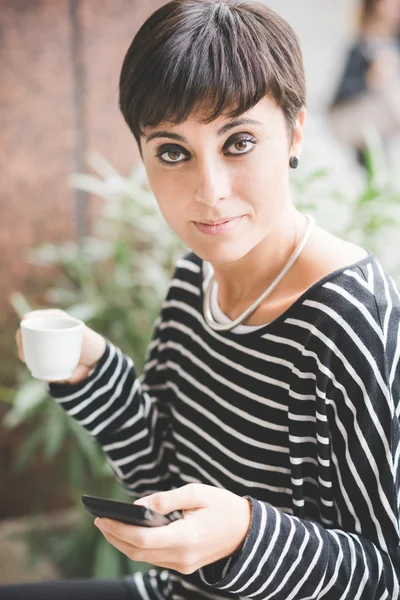 Young handsome woman drinking coffee — Stock Photo, Image