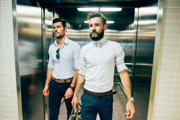 Two young handsome modern businessmen — Stock Photo, Image