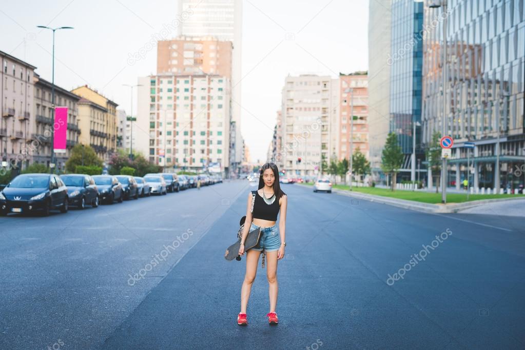 woman skater posing in city
