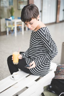 Young handsome woman drinking coffee